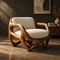 Armchair with a looped sculpted wood frame and a cushioned seat, three-quarter view showing the grain