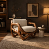 Armchair with a looped sculpted wood frame and a cushioned seat in a dark living room at golden hour