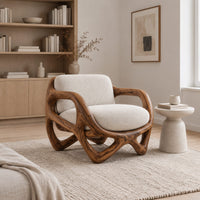 Armchair with a looped sculpted wood frame and a cushioned seat in a Scandinavian living room with white walls