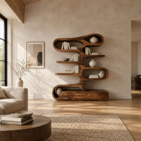 Tall bookshelf of stacked looping shelves on a solid base in a bright open plan living room