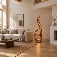 Flame shaped floor lamp with glowing loops and a small flat ledge in a bright open plan living room