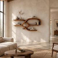 Looping ribbon wall shelves with crossing wooden arms for books and bowls in a bright open plan living room