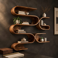 Corner detail of looping ribbon wall shelves with interlocking pockets beside wood, brass and linen samples