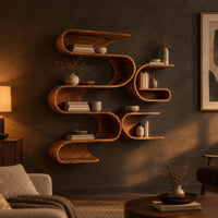 Looping ribbon wall shelves with interlocking pockets in a dark living room at golden hour