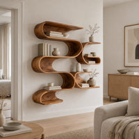 Looping ribbon wall shelves with interlocking pockets in a Scandinavian living room with white walls