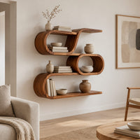 Looping wooden wall shelves with a middle oval cell and curled ends in a Scandinavian living room with white walls