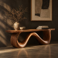 Bench with a flat slab seat on a looping wave shaped base, three-quarter view showing the grain