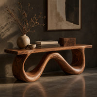 Corner detail of bench with a flat slab seat on a looping wave shaped base beside wood, brass and linen samples
