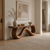 Bench with a flat slab seat on a looping wave shaped base in a Scandinavian entryway with white walls