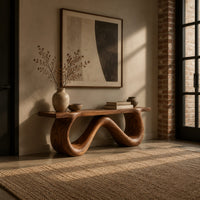 Bench with a flat slab seat on a looping wave shaped base in an industrial loft entryway with exposed brick