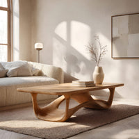 Looping wave base coffee table with pale top in a bright modern living room