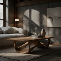 Looping wave base coffee table with pale top in a concrete and timber loft