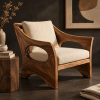 Corner detail of lounge chair with oval side cutouts and an arched wooden base beside wood, brass and linen samples