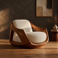 Lounge chair with a sculpted wooden shell and cream seat cushion in a dark studio against a charcoal plaster wall