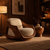 Lounge chair with a sculpted wooden shell and cream seat cushion in an evening living room with walnut wall paneling