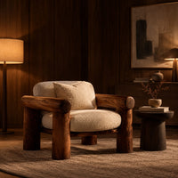 Lounge chair with thick log style arms, post legs and cream cushions in an evening living room with walnut wall paneling