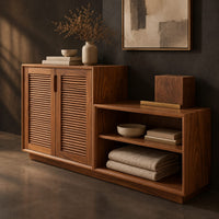 Corner detail of stepped low cabinet with two louvered doors and an open shelf section beside wood, brass and linen samples