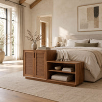 Stepped low cabinet with two louvered doors and an open shelf section in a bright open plan bedroom
