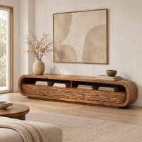 Low capsule shaped tv stand with wave carved fronts and open bays in a Scandinavian living room with white walls