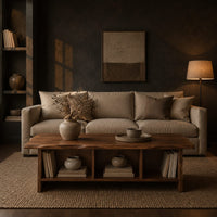 Low coffee table with a wavy natural edge top and three open cubbies in a dark living room at golden hour