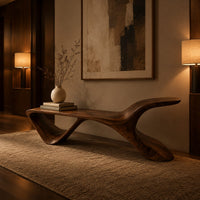 Low wooden bench with a swept up end and an open triangle leg in an evening entryway with walnut wall paneling