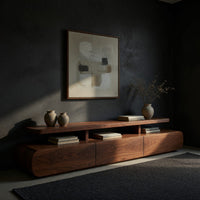 Low drawer plinth TV stand with a floating shelf, three-quarter view showing the grain