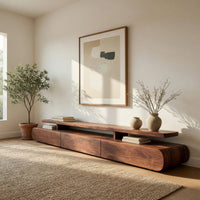 Low drawer plinth TV stand with a floating shelf in a bright modern living room