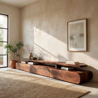 Low drawer plinth TV stand with a floating shelf in an open plan space in daylight