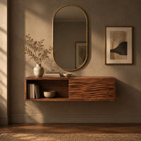 Corner detail of floating makeup vanity with an open cubby and a wave carved front panel beside wood, brass and linen samples
