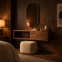 Floating makeup vanity with an open cubby and a wave carved front panel in an evening bedroom with walnut wall paneling