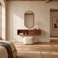 Floating makeup vanity with an open cubby and a wave carved front panel in a bright open plan bedroom