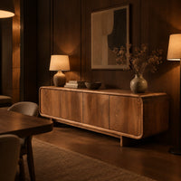 Low wood sideboard with four flat front panels and short legs in an evening dining room with walnut wall paneling