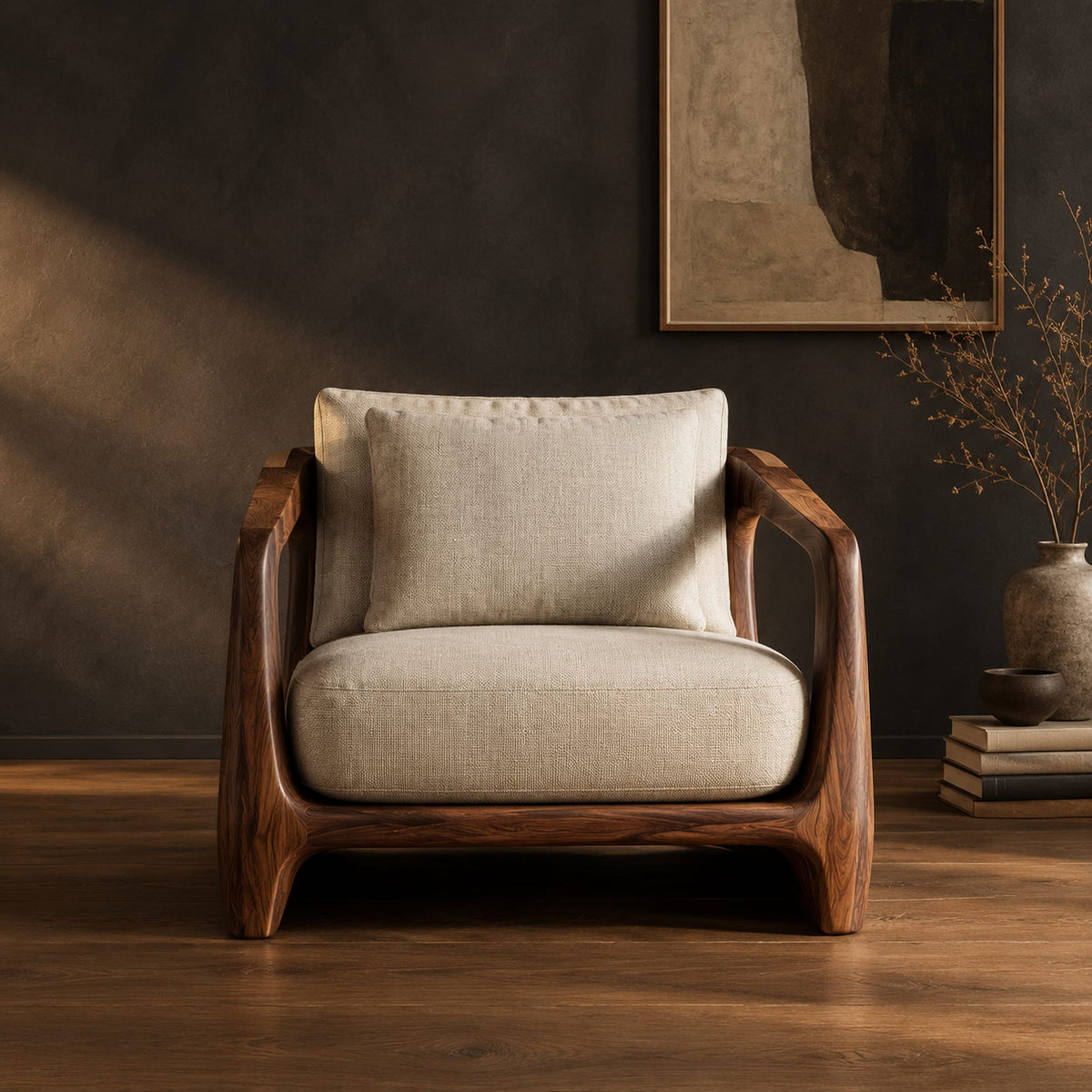 Low wooden chair with open arms and oval cutouts in the sides in a dark studio against a charcoal plaster wall