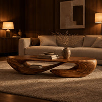 Low oval coffee table on a twisted open loop base in an evening living room with walnut wall paneling