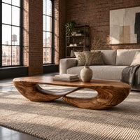 Low oval coffee table on a twisted open loop base in an industrial loft living room with exposed brick