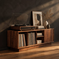 Low wood record console with three open cubbies and a panel end, three-quarter view showing the grain
