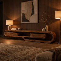 Low tv stand shaped like a looping wood ribbon with two boxed front sections in an evening living room with walnut wall paneling