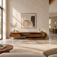Low tv stand shaped like a looping wood ribbon with two boxed front sections in a bright open plan living room