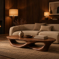 Low coffee table with an oval top and twin open loops in an evening living room with walnut wall paneling