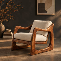 Low lounge chair with looped side frames, sloped arms and cream cushions, three-quarter view showing the grain