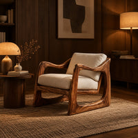 Low lounge chair with looped side frames, sloped arms and cream cushions in an evening living room with walnut wall paneling