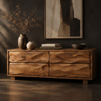 Low bench with four wavy grain front panels on short block feet, three-quarter view showing the grain
