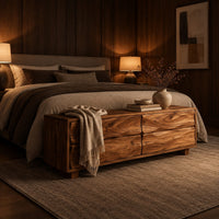 Low bench with four wavy grain front panels on short block feet in an evening bedroom with walnut wall paneling