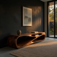 Low TV console with a carved crossing hollow in a living room at golden hour