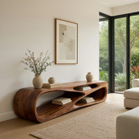 Low TV console with a carved crossing hollow in a bright modern living room
