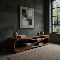 Low TV console with a carved crossing hollow in a concrete and timber loft