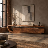 Low tv stand with a looped top over four flat front panels in an industrial loft living room with exposed brick