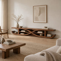 Low tv stand with crossed curves and upturned sled ends in a Scandinavian living room with white walls
