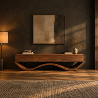 Low tv stand with three front panels on a wave shaped base in a dark living room at golden hour
