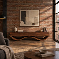 Low tv stand with three front panels on a wave shaped base in an industrial loft living room with exposed brick